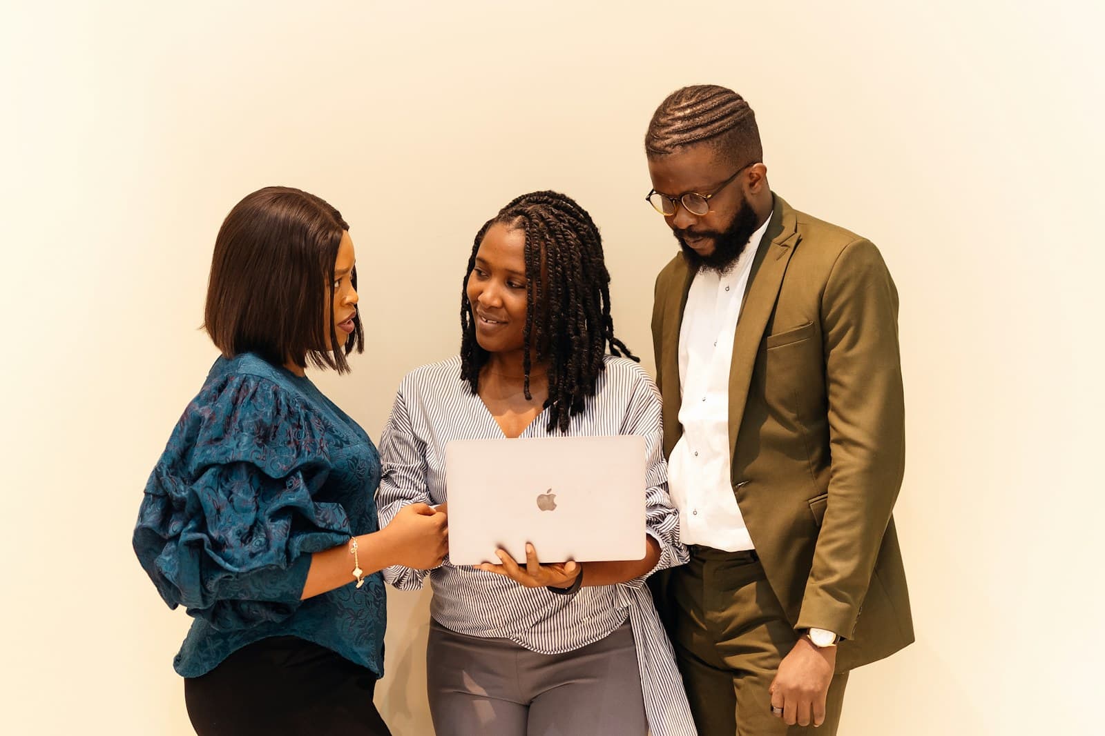 African business team discussing a digital project on a laptop